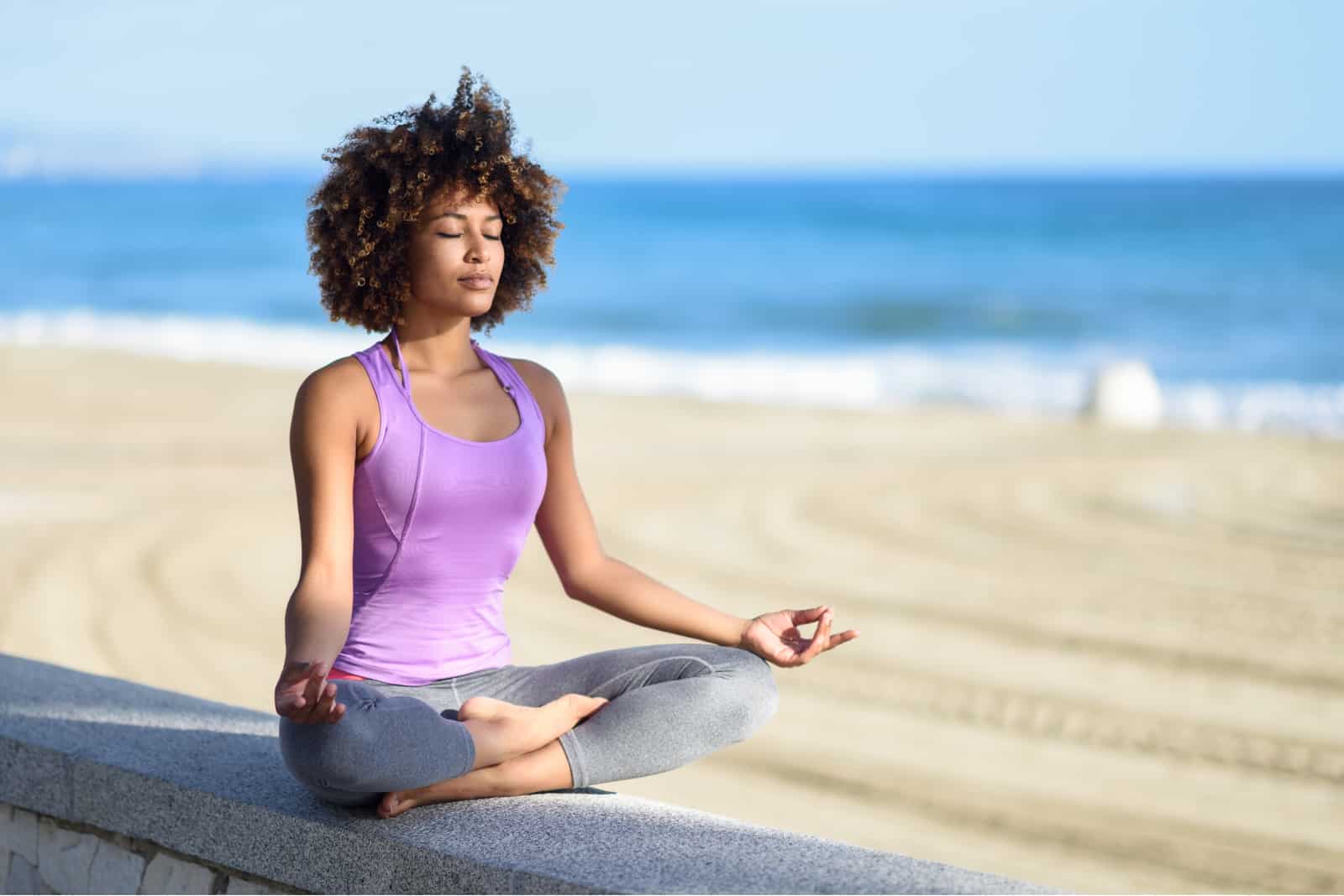 a woman sitting and meditating