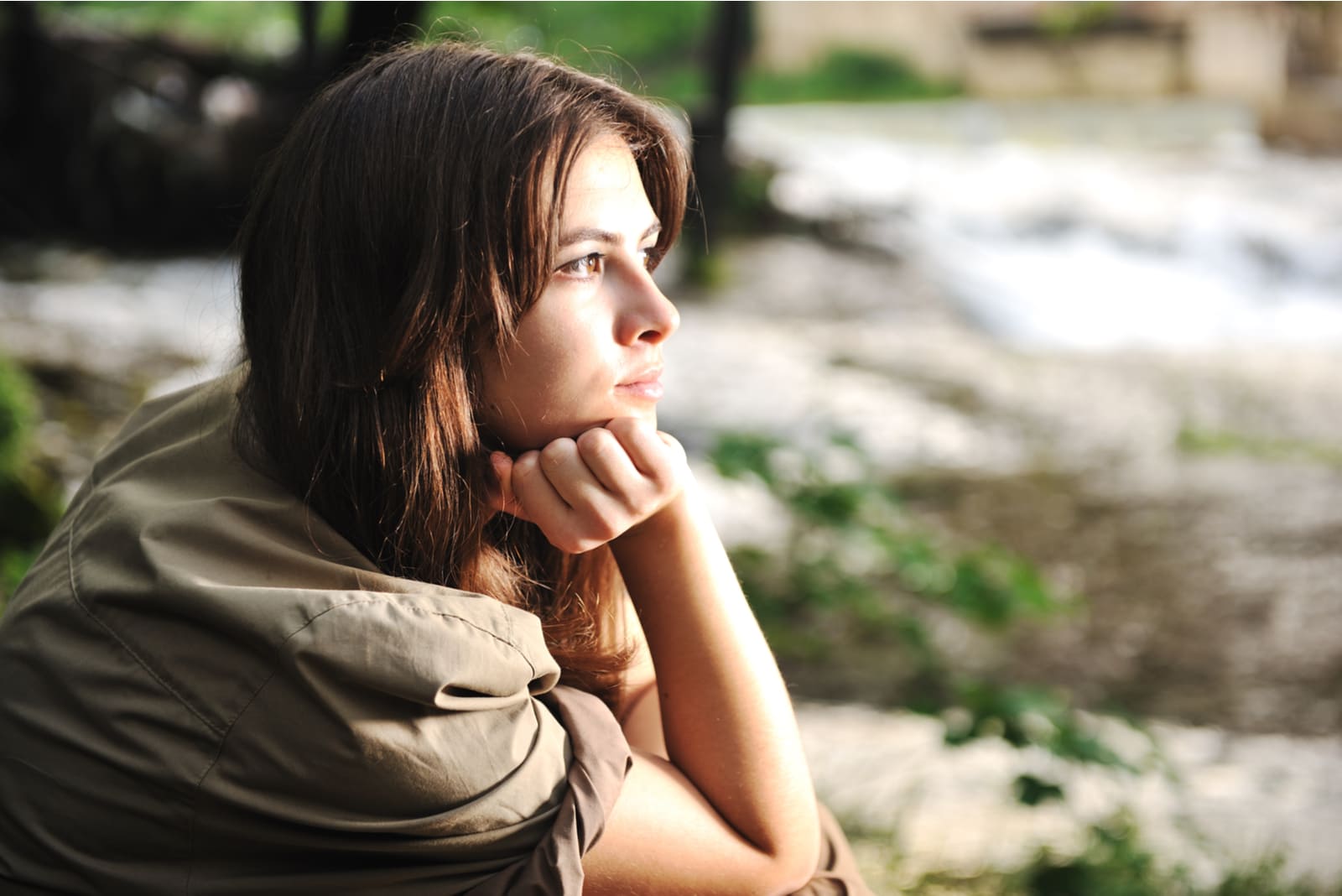 woman sitting alone in nature