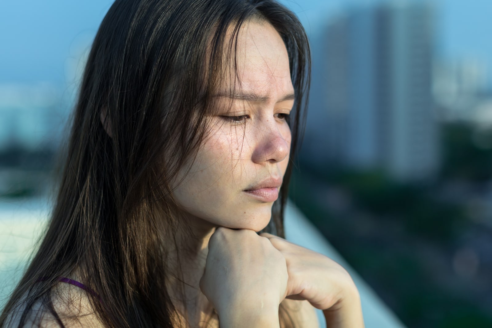 woman depressed on her balcony