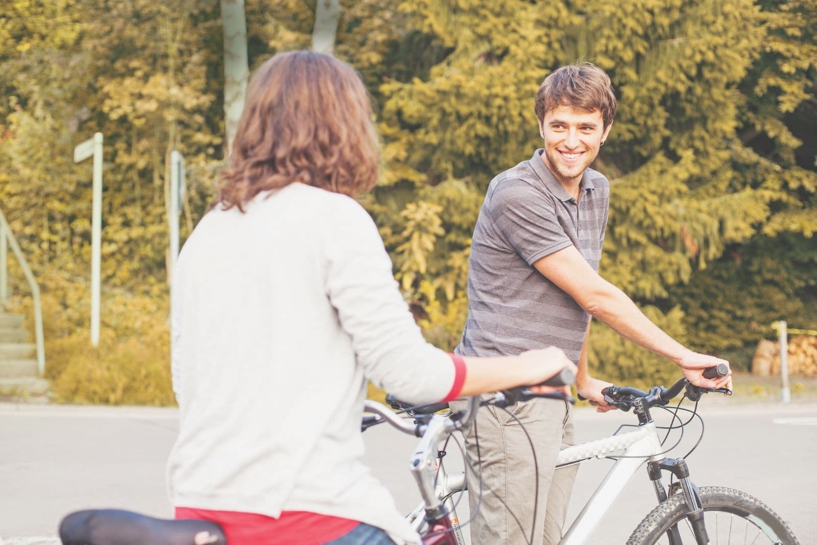 man and woman biking on the road stopped and talked for a while