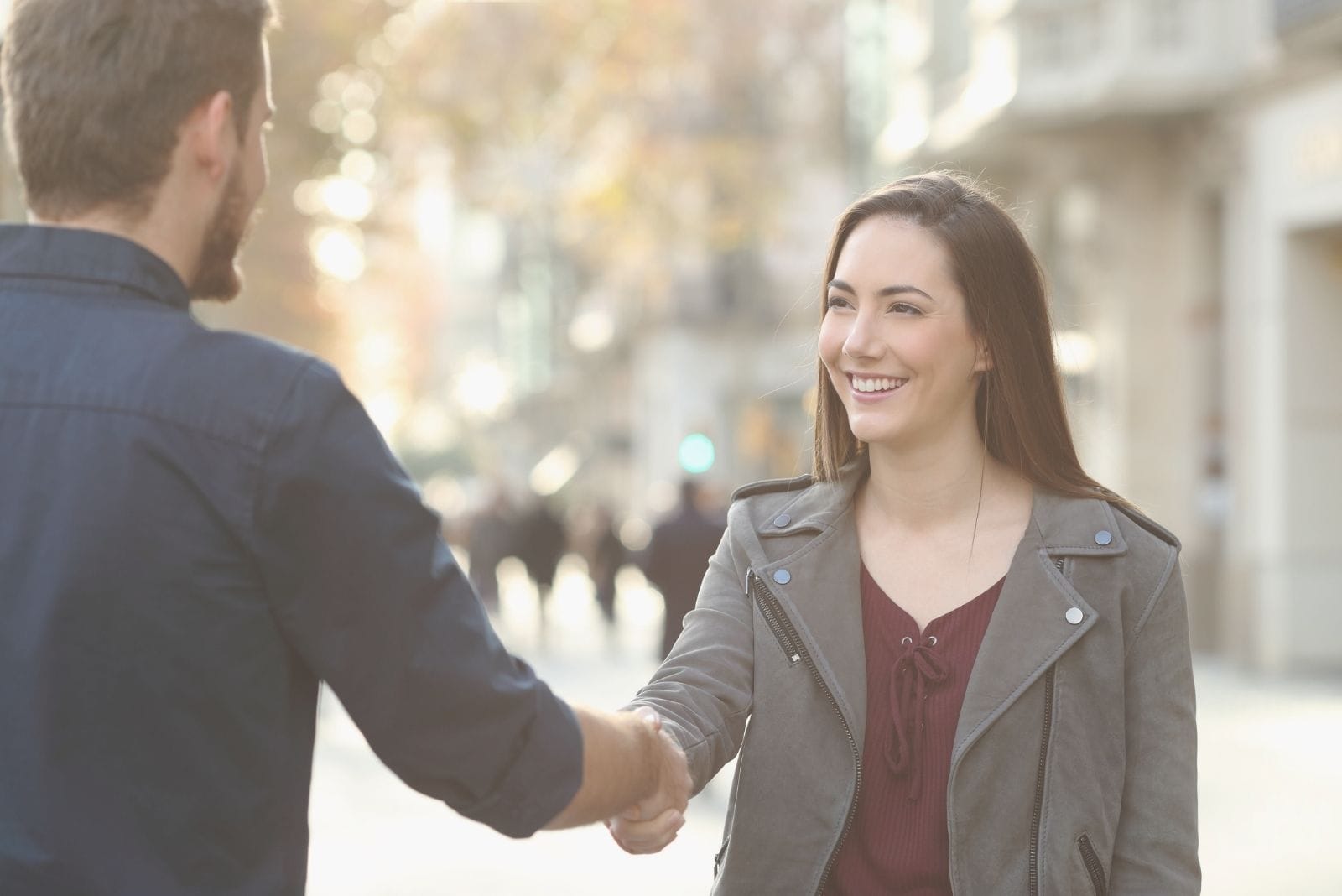 man and woman first meeting at the street