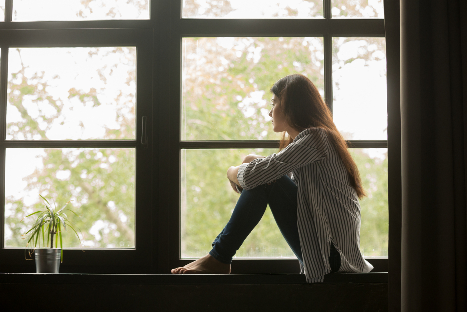 woman sitting by window