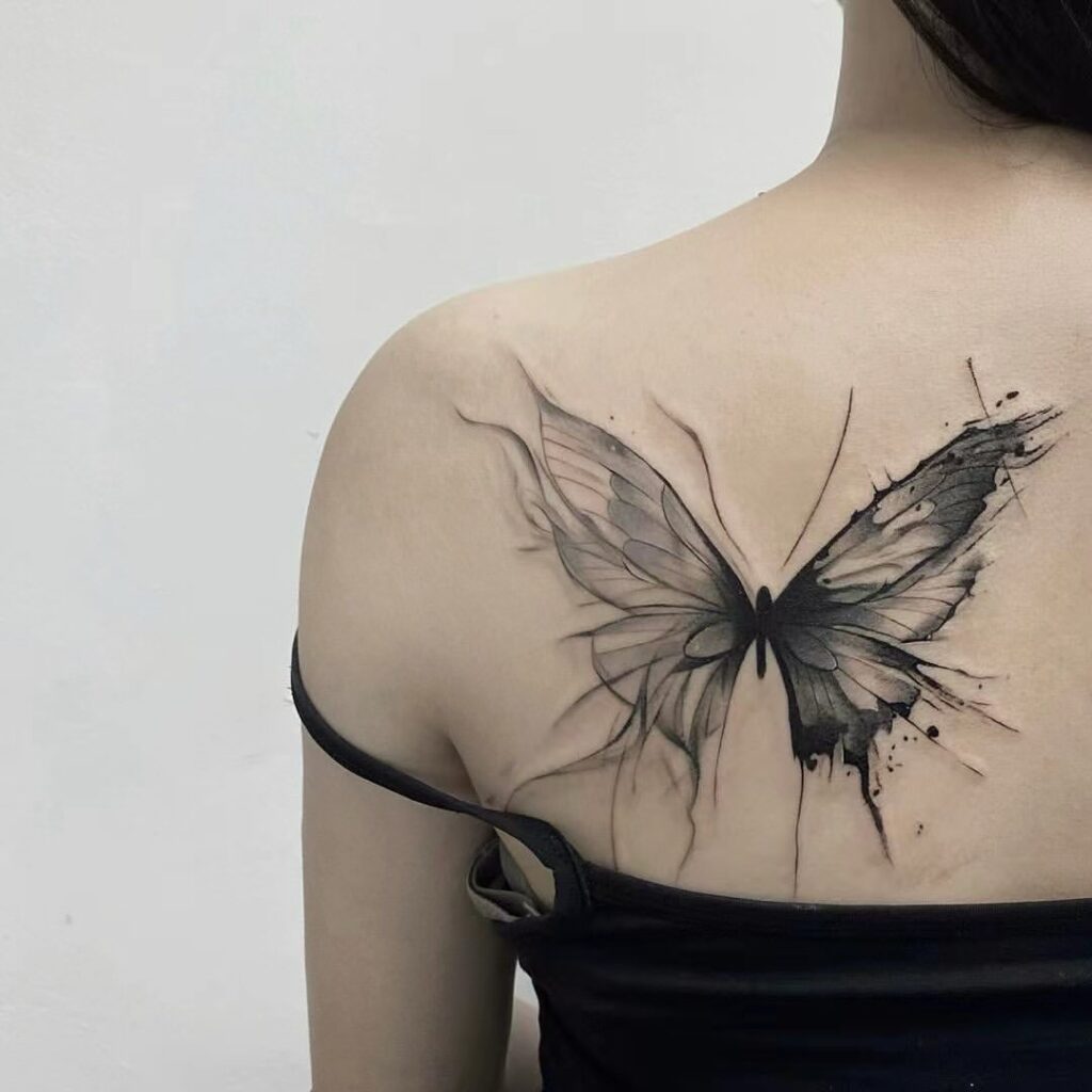 Bold Black Ink Butterfly Tattoo