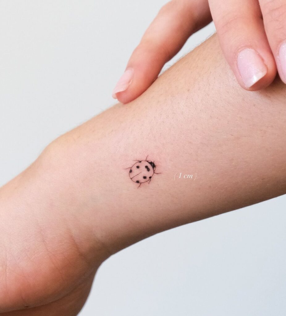 Charming Ladybug Wrist Tattoo