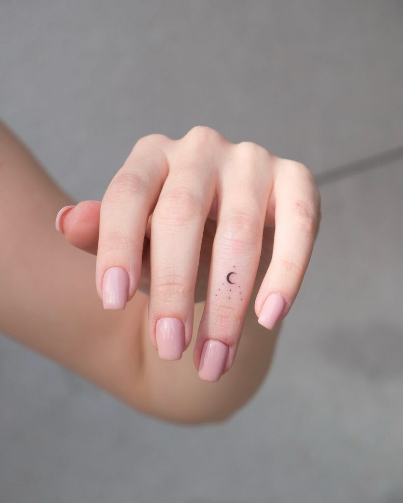 Tiny Moon Finger Tattoo