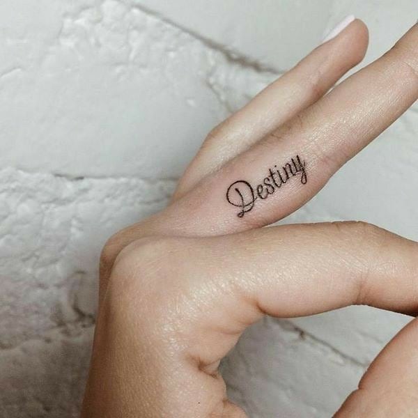 Empowering Word Small Finger Tattoo