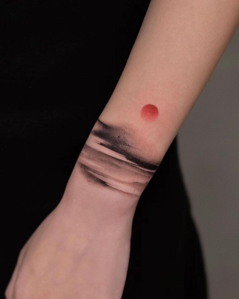 sunset sea sky wrist tattoo