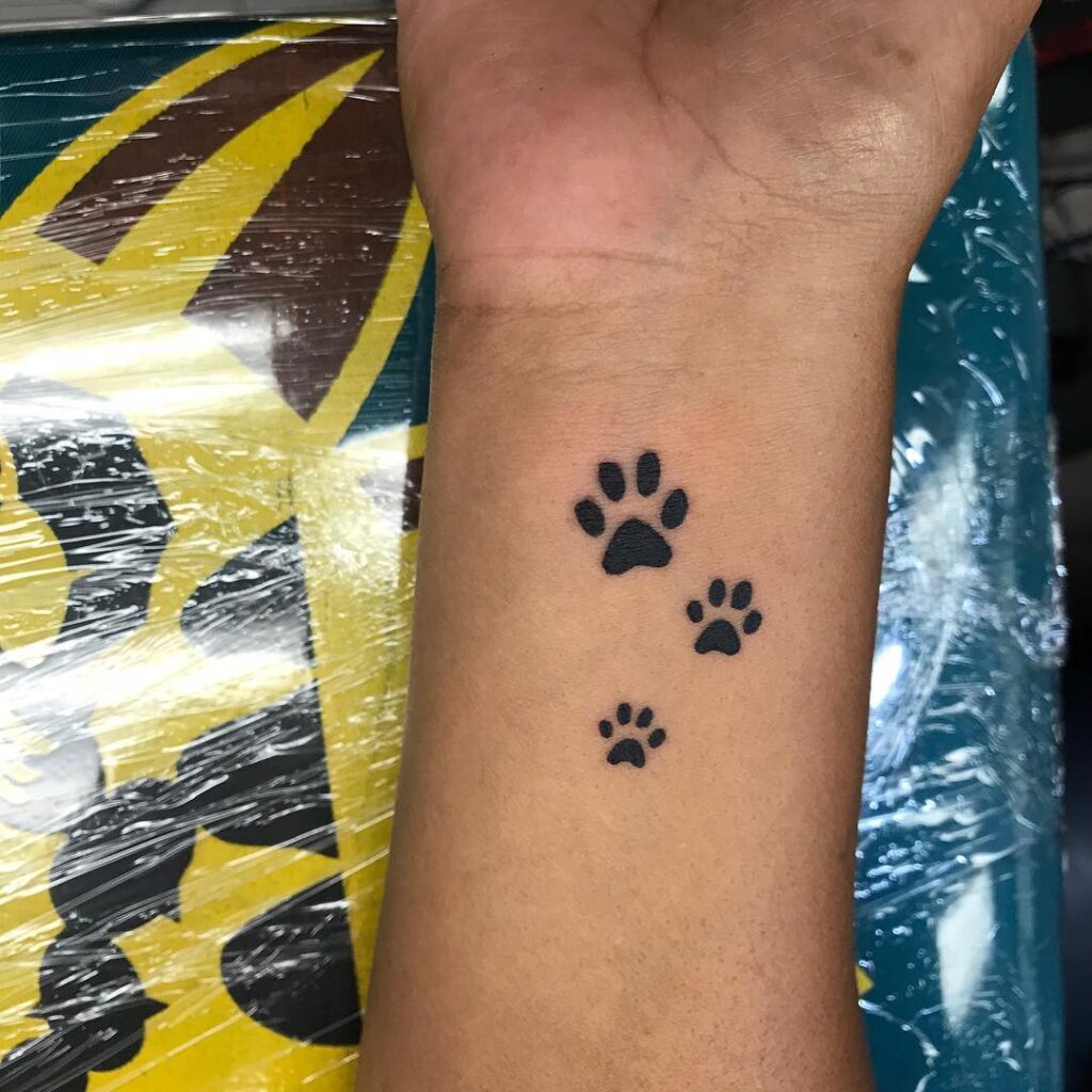 paws wrist tattoo