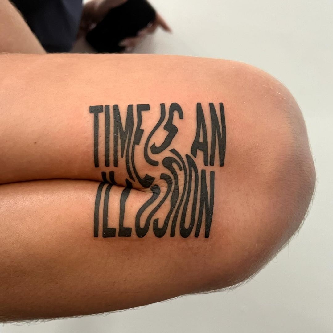 Modern Art-Inspired Lettering Tattoo