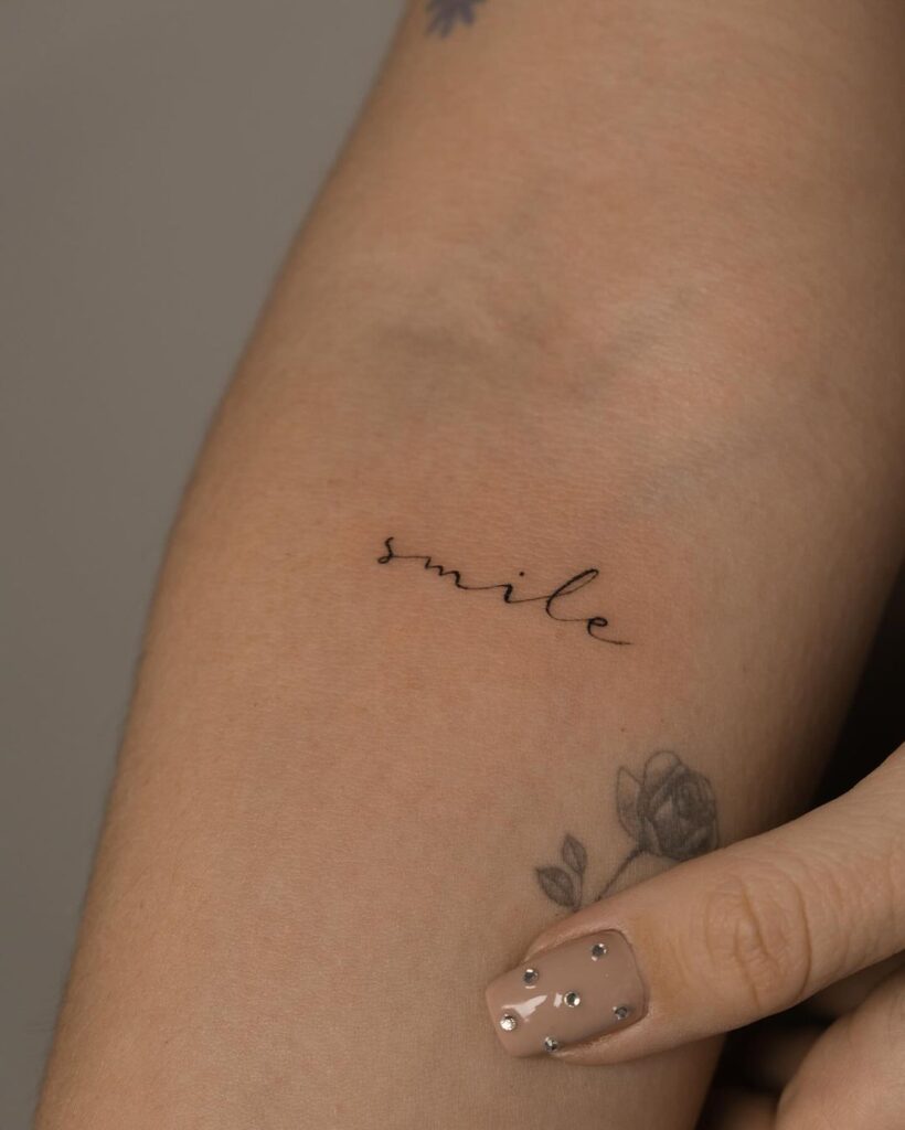 Simple Fine-Line Script Tattoo