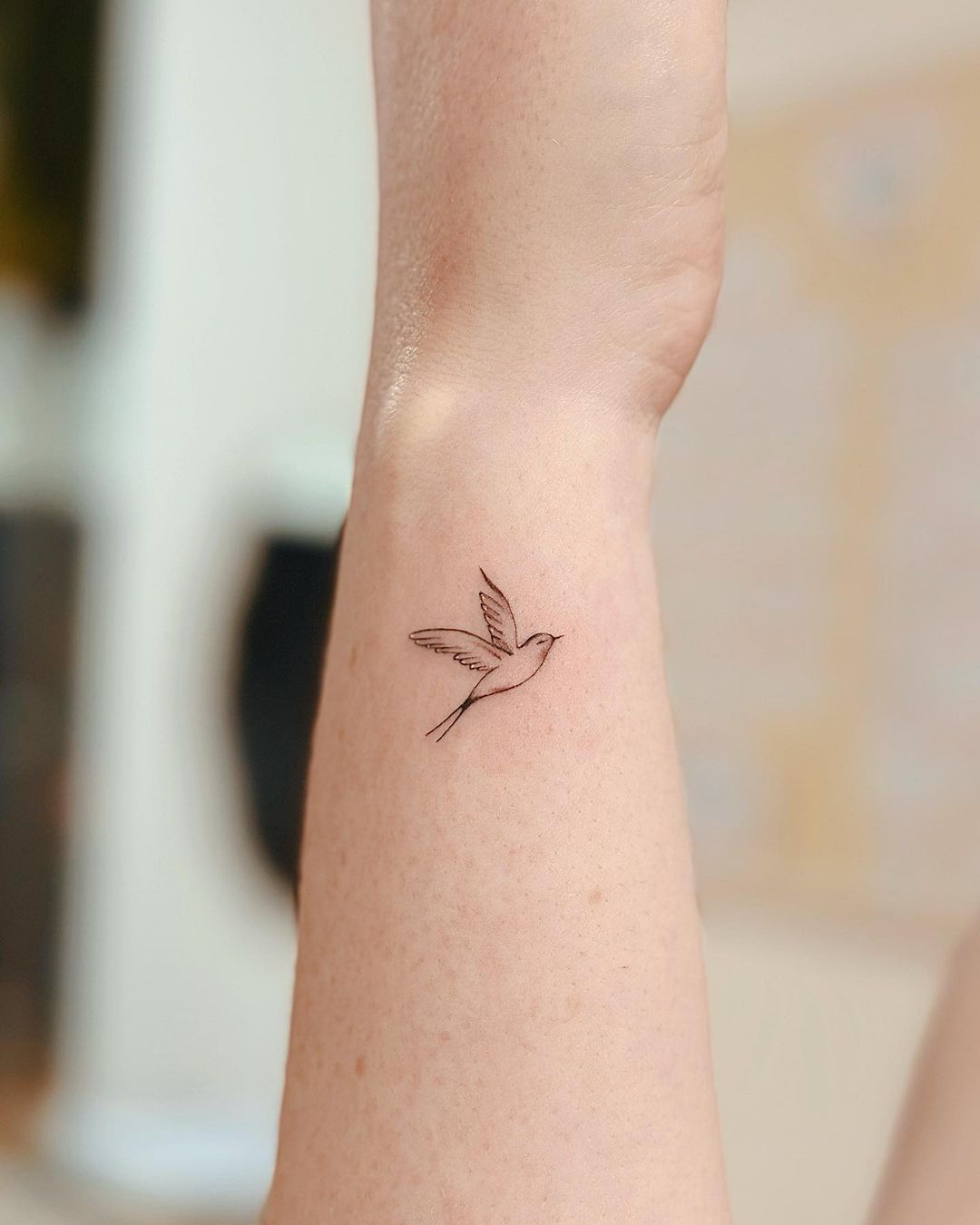 small bird tattoo