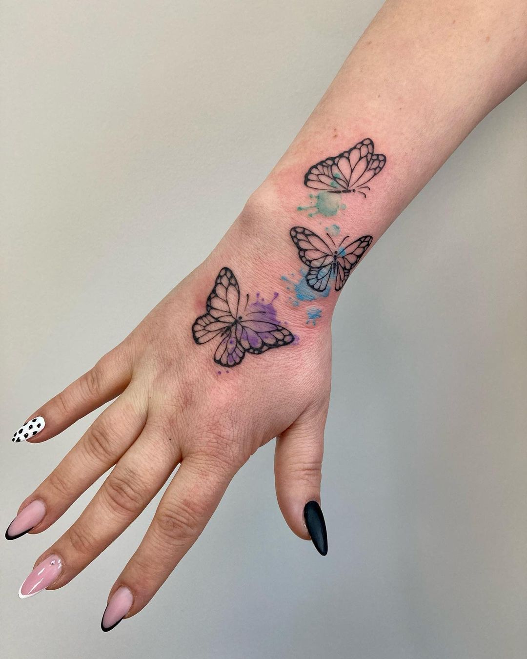 butterfly hand tattoo