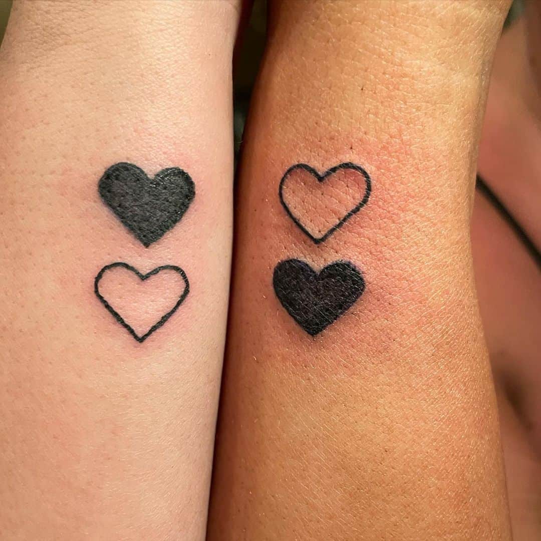 Black & white hearts matching best friends tattoo