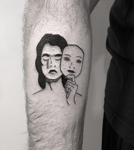 Girl wearing a mask tattoo