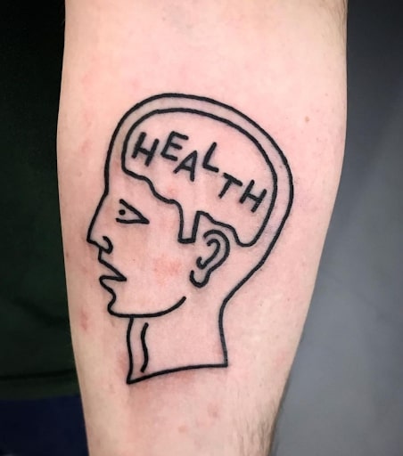 Health written on a brain tattoo