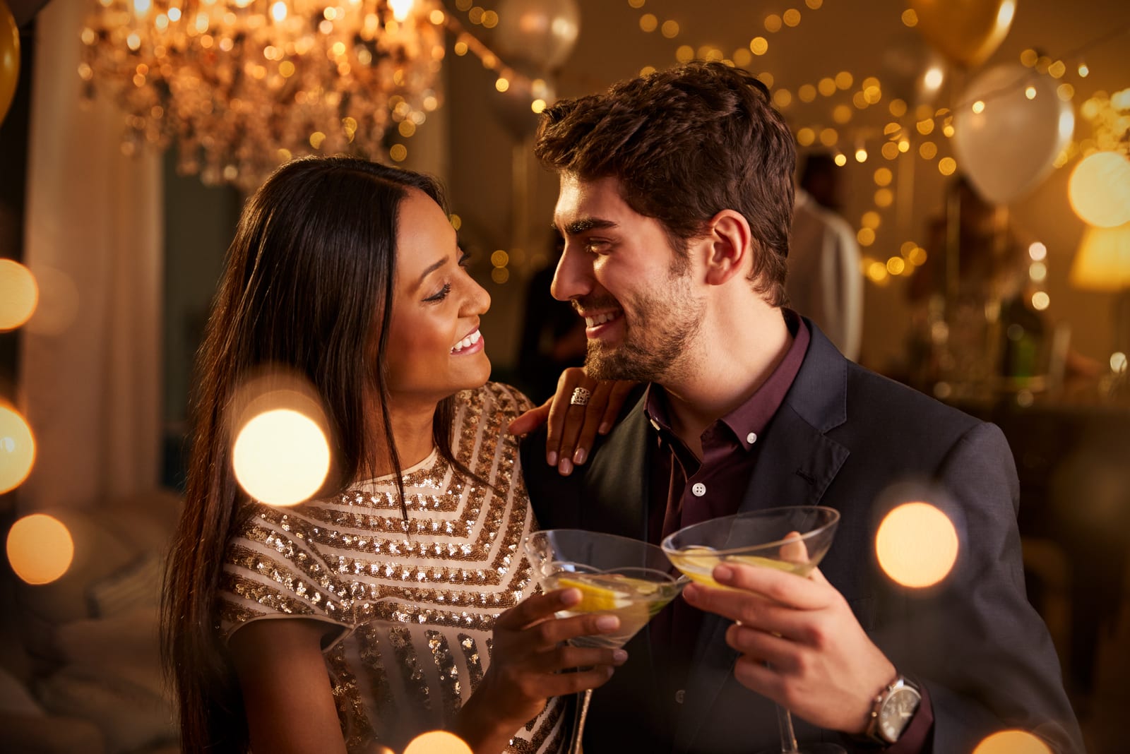 a loving couple at a party toasts