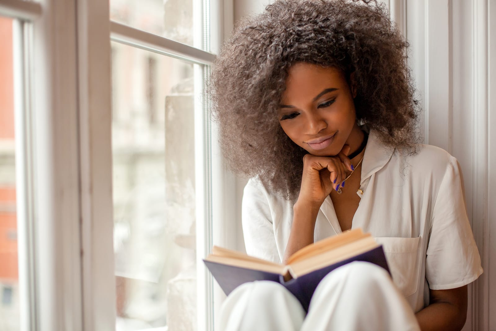 young woman reading a book