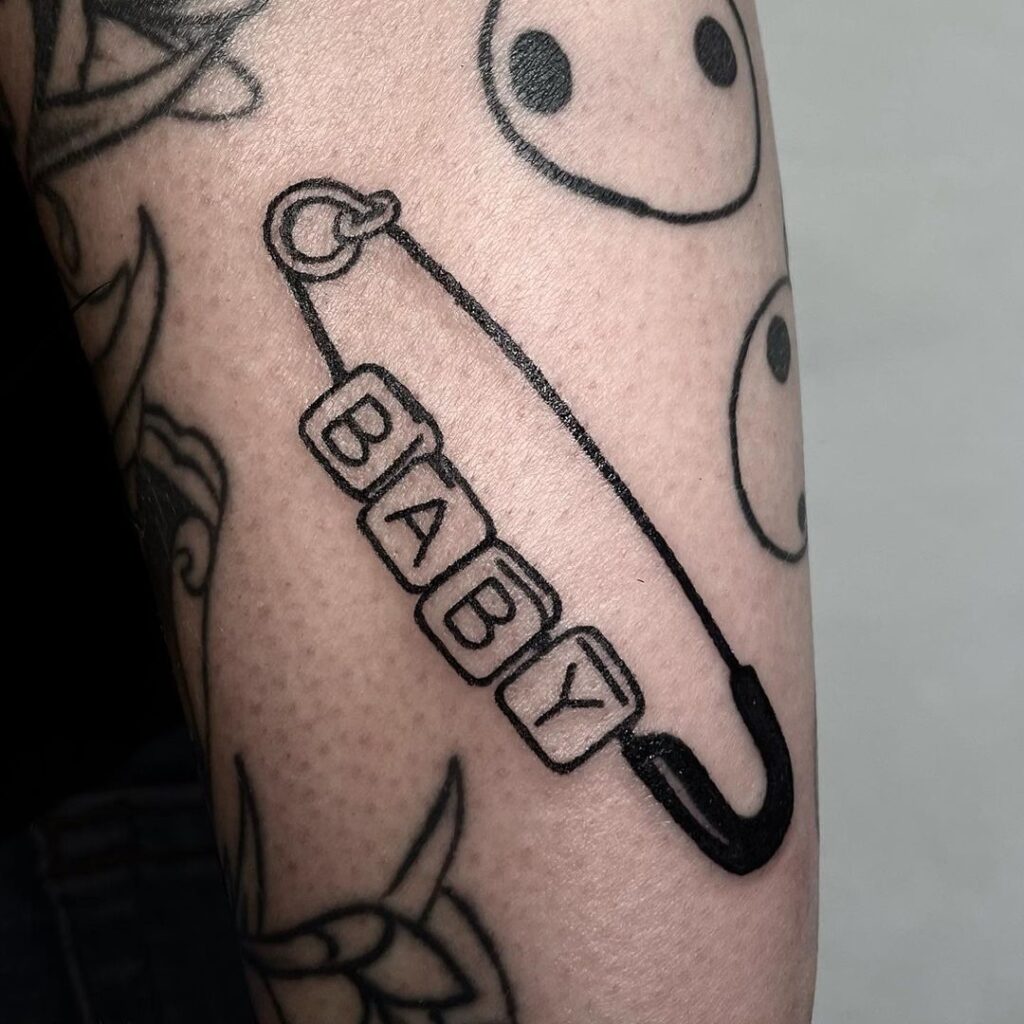 Safety Pin With Letter Blocks Tattoo