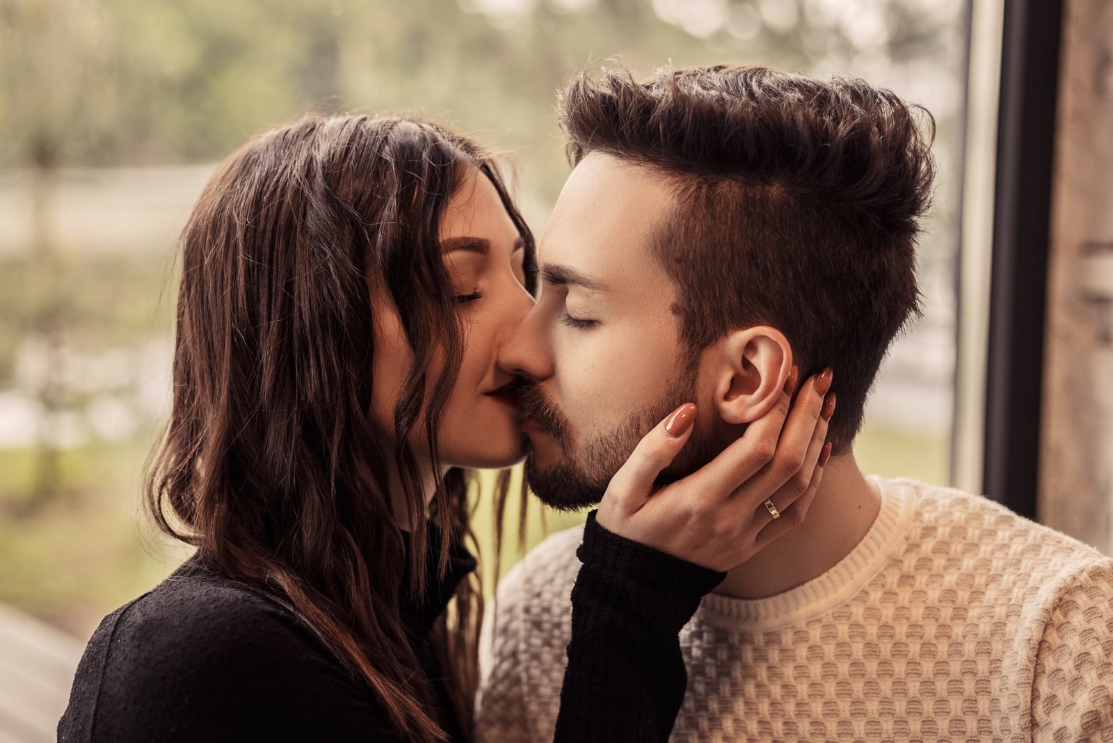 a loving couple passionately kiss